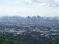 The Metro Manila skyline from San Mateo, Rizal, looking at Makati CBD, Ortigas CBD, Eastwood City and Bonifacio Global City.