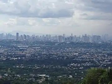 The Northern Metro Manila skyline from San Mateo, Rizal, looking at Manila, Araneta City, and Quezon City.