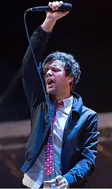Angelakos performing with Passion Pit at Lipton's Be More Tea Festival at Riverfront Park in North Charleston, South Carolina in 2015