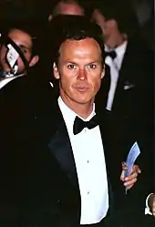 A formally-dressed Michael Keaton