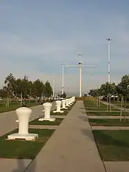 Middle Harbor Shoreline Park, with the mast of USS&nbsp;Oakland in the distance.