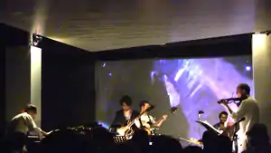 Atwood-Ferguson (right) performing with the Miguel Atwood-Ferguson Ensemble in Los Angeles in 2014