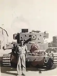 Mike Flanagan, in front of a Cromwell Tank in Israel, 1948