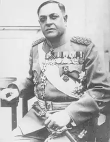 a black and white photograph of a male in dress uniform