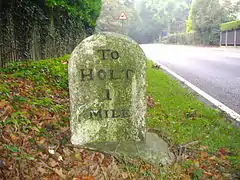 A mile stone on the A148 in the village of High Kelling