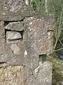 Re-used stones in the gable end wall