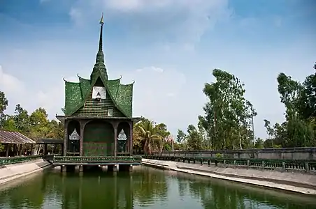 Wat Pa Maha Chedi Kaew (Thai: วัดป่ามหาเจดีย์แก้ว, The Million Bottle Temple) – a Buddhist temple in Khun Han district of Sisaket province, Thailand, made of over 1 million empty discarded beer bottles.