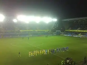 AFC Wimbledon and Millwall players met for the first time in the FA Cup at The Den in 2009.
