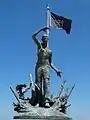 Liberation statue with POW flag