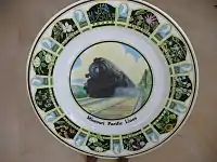 Here the cavetto is left plain, apart from an inscription.