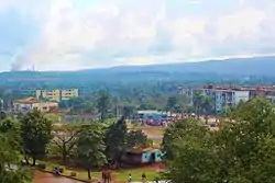 A photo of Moa with the manynickel factories in the background