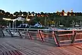 The pier in Płock, Poland. The view on the Tumskie Hill and the amphitheatre by night from the pier, with Płock Cathedral and the castle.