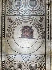 Zephyrus and Boreas surround Oceanus in a mosaic from Portugal.