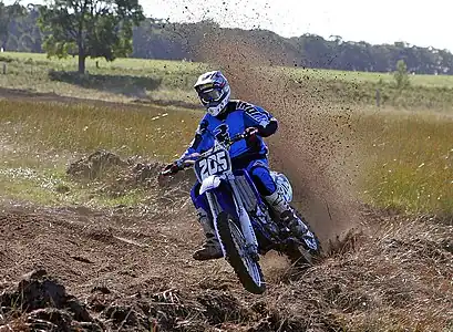 Image 23MotocrossCredit: Fir0002Motocross is form of motorcycle or ATV racing held on enclosed off-road circuits. The tracks are often quite large, natural, terrains with very few man made jumps, unlike Supercross, a sport that was originally derived from Motocross and is executed on a smaller track with many more extreme man made obstacles.More selected pictures