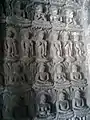 Multiple depictions of Buddha on a wall at Ajanta Caves