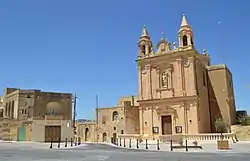 View of Munxar parish church and surroundings