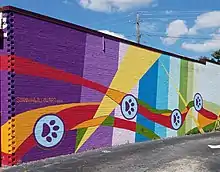 Mural by Shannon Willow in East Atlanta featuring dog paws