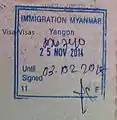 Entry stamp at Yangon International Airport for entries using conventional visas. The visas are stickers stuck on another page of the passport