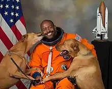 Image 15NASA astronaut Leland D. Melvin with his dogs Jake and Scout (from Dog behavior)
