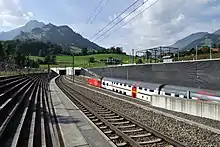 Tunnel entrance, with a double-decker train approaching