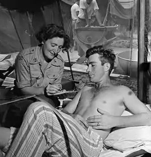 A Norwegian nurse tending to a Canadian soldier