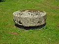 Old millstone from the village on public display