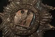 Embroidered insignia of the Legion of Honour, detail of Napoleon's uniform of colonel of the Chasseurs à cheval of the Imperial Guard.