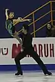 An ice dancing lift (performed by pairs skaters) with the lifting partner in an Ina Bauer position (Narumi Takahashi & Mervin Tran)