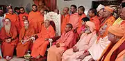 Bodhinatha attends a conference of Natha Sampradaya swamis hosted by Balagangadharanatha Swamiji. Includes Yogi Adityanath on center right.