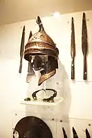 Phrygian helmet with large cheekpieces.