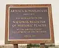 The National Register of Historic Places marker at the front of the schoolhouse.