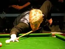 Neil Robertson playing a shot on the pink ball.