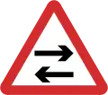 B22: Two-way traffic crosses one way road