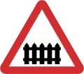 B41: Railway level crossing ahead with gate or barrier