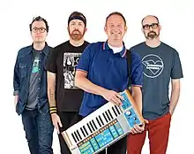 (L–R) Ben Pringle (bass); Linus of Hollywood (guitar, keyboard); Parry Gripp (vocals, guitar); Steve Sherlock (drums)