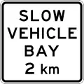 (A42-4/IG-9) Slow Vehicle Bay Ahead (in 2 kilometres)