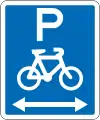 (R6-52.1) Cyclists Parking (on both sides of this sign)