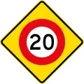 (W10-3) 20&nbsp;km/h speed limit ahead