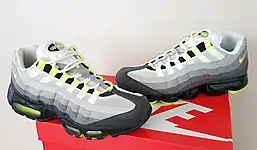 Air Max 95 (1995) next to the Vapormax 95 Hybrid (2018) in the original "Neon" colorway