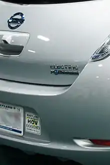 Nissan Leaf electric car with Maryland's sticker to identify plug-in electric vehicles eligible to use HOV lanes with solo drivers.