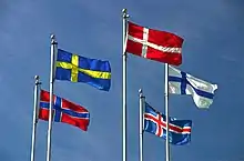 The flags of Denmark, Iceland, Finland, Sweden, and Norway flying on flagpoles