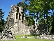 North transept from the south east. The blocked doorway leads to the sacristy