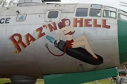 Nose art on B-29A Superfortress "Raz'n Hell", Kilroy is seen in the top left corner