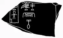 Fragment of black schist presenting Nubnefer´s name beside the building ″Menti Ankh″ (left)