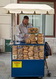 A street vendor in Kraków, Poland, selling pretzels, as well as obwarzanki krakowskie and bagels