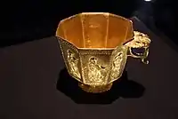 A Tang octagonal gold cup with a thumb plate at the top of its handle, manufactured probably in Yangzhou, Jiangsu
