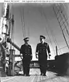 Hustvedt (right) with Admiral Royal E. Ingersoll (left) aboard USS&nbsp;Constellation&nbsp;(IX-20) at Newport, Rhode Island, while serving as Ingersoll's chief of staff, February 1942