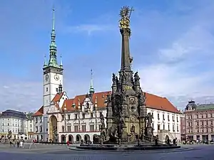 Horní Square – the largest square in Olomouc(on right, the Holy Trinity Column; to the left, the Olomouc City Hall with its astronomical clock)