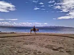 El Ostional Beach and a local on horseback.