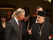 Charles conversing with Czech Orthodox priest Jaroslav Šuvarský